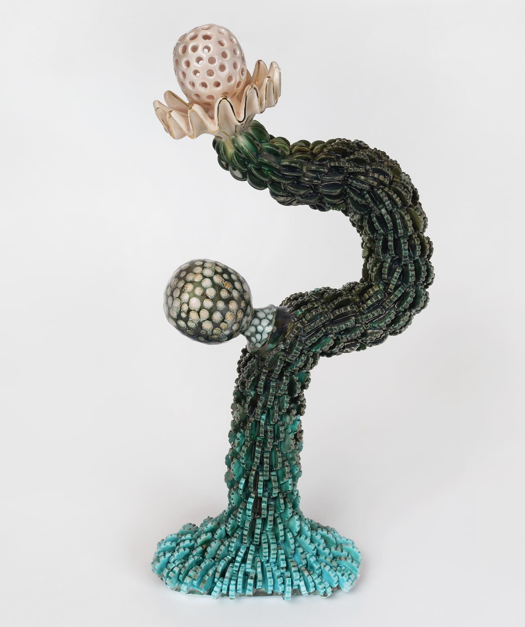 a ceramic sculpture by Megan Bogonovich resembling an abstract, otherworldly plant or flower